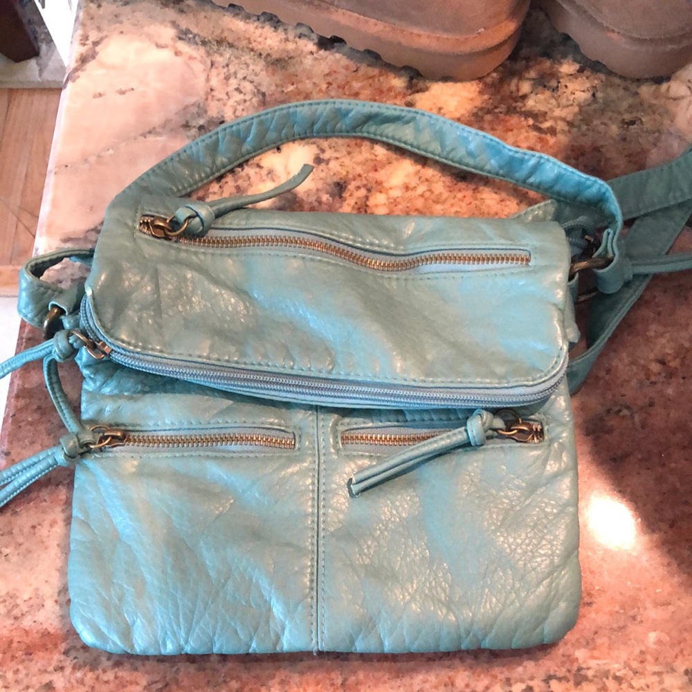 Woman’s teal crossbody